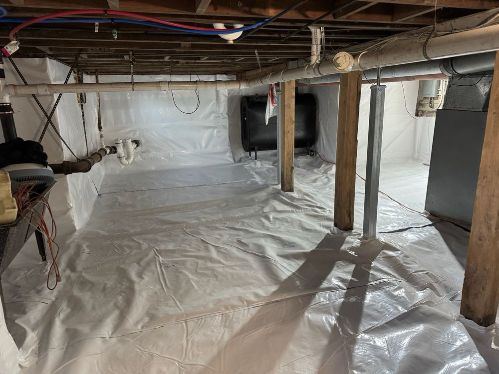 Crawl space encapsulation by Basement Waterproofing Akron, liner sealed to the walls and posts
