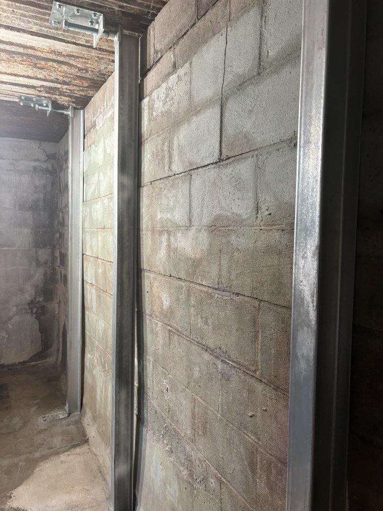 Foundation wall braced and sealed during basement waterproofing in Akron, OH