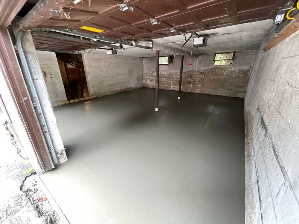 New concrete floor poured after basement waterproofing in Goodyear Heights, Akron