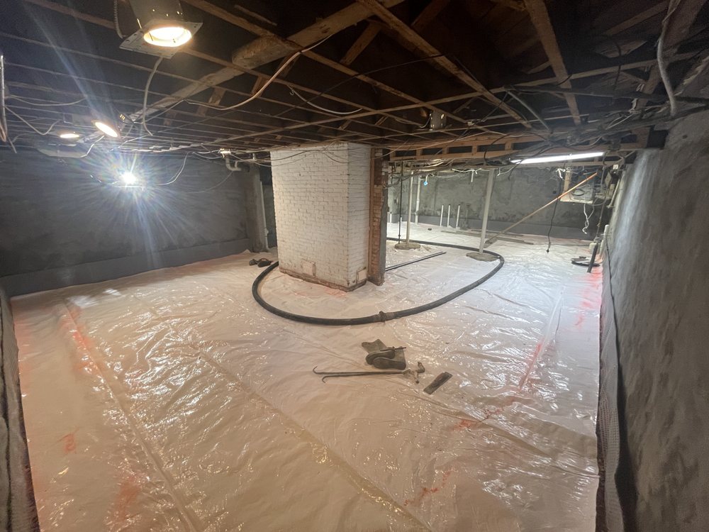 Basement walls and floor sealed against water during basement waterproofing in Akron, OH