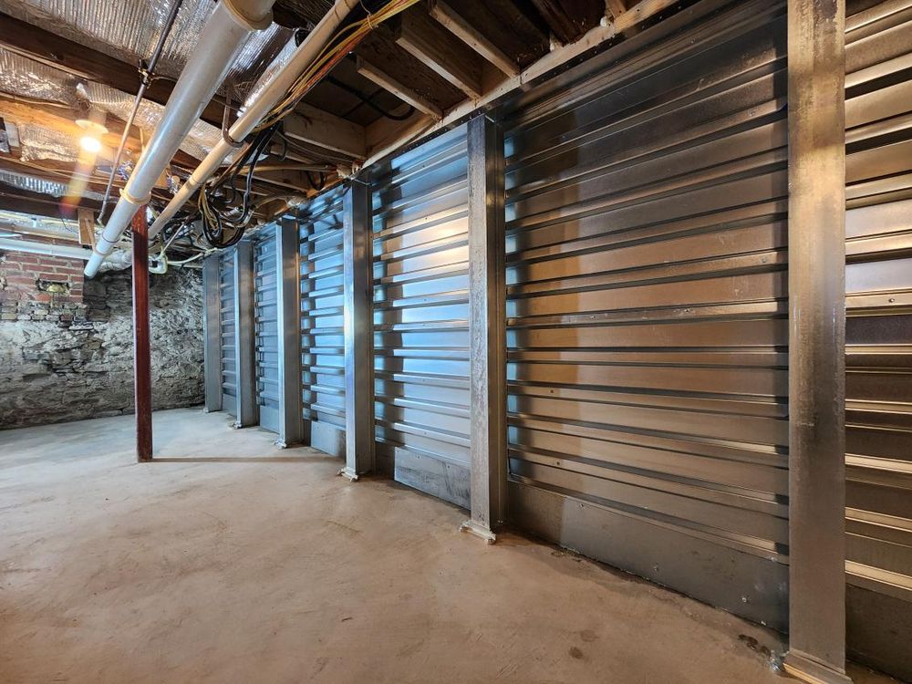 Steel I-beams bracing a basement wall, foundation repair by Basement Waterproofing Akron